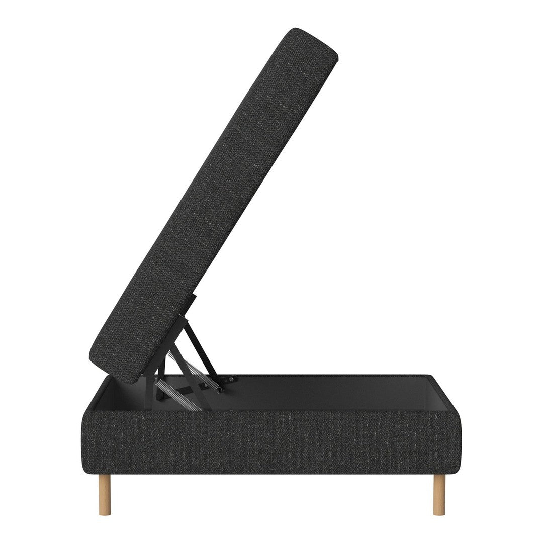 Modern black upholstered storage bed with a textured pattern and light wooden legs, angled for easy access.