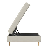 Light beige upholstered storage bench with natural wooden legs, featuring a textured pattern and a sleek black interior.
