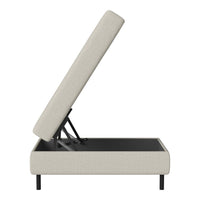 Beige upholstered storage bench with black metal frame and simple, modern design. Ideal for minimalist decor.