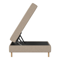 Beige storage bed with a clean, modern design and light wooden legs, featuring a simple textured fabric.