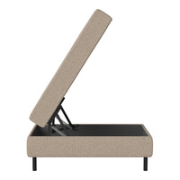 Beige upholstered storage bed with a textured fabric and sleek black metal frame. Modern, minimalist design.