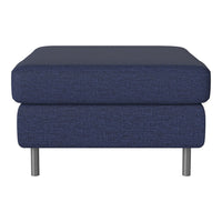 Navy blue upholstered ottoman with a textured pattern and sleek silver legs, perfect for modern decor.