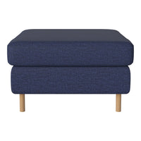 Navy blue upholstered ottoman with a textured pattern and light wooden legs. Perfect for modern living spaces.