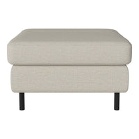 Light beige upholstered ottoman with a smooth texture and minimalist design. Black metal feet add contrast.