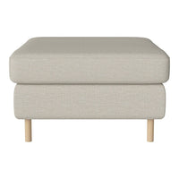 Light beige upholstered ottoman with a textured fabric and natural wooden legs. Simple, modern design.