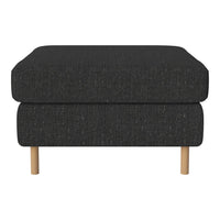 Black textured ottoman with a minimalist design and light wood legs. Ideal for modern living spaces.