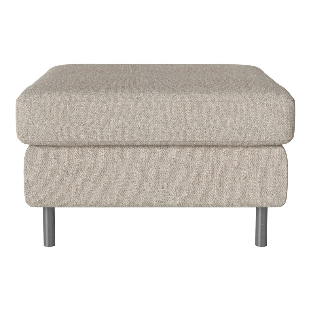Beige upholstered ottoman with a soft texture, featuring a minimalist design and sleek silver legs.