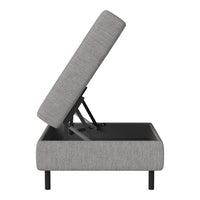 Gray upholstered storage ottoman with a sleek fabric texture and black metal frame.
