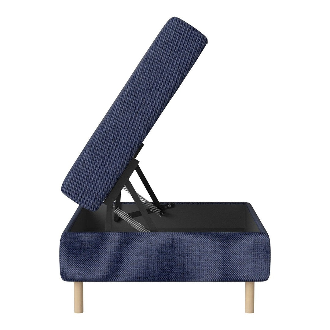 Navy blue upholstered storage ottoman with a textured pattern and light wood legs, showcasing a lift-top design.