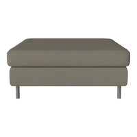 "Modern ottoman in soft gray fabric with subtle texture and sleek metal legs."