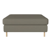Olive green upholstered ottoman with a smooth texture and light wooden legs. Modern, minimalist design.