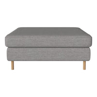 Gray upholstered ottoman with a clean, minimalist design and natural wood legs, perfect for modern interiors.