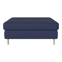 Navy blue upholstered ottoman with a textured finish and light wood legs, perfect for modern decor.