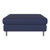 Navy blue upholstered ottoman with a textured pattern and silver legs. Modern design for versatile decor.