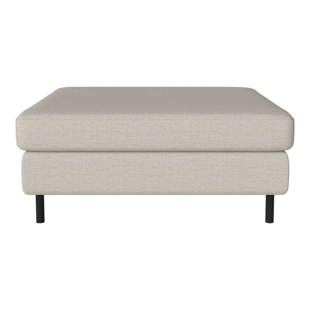 Light beige fabric ottoman with a smooth texture and black metal legs, ideal for modern decor.