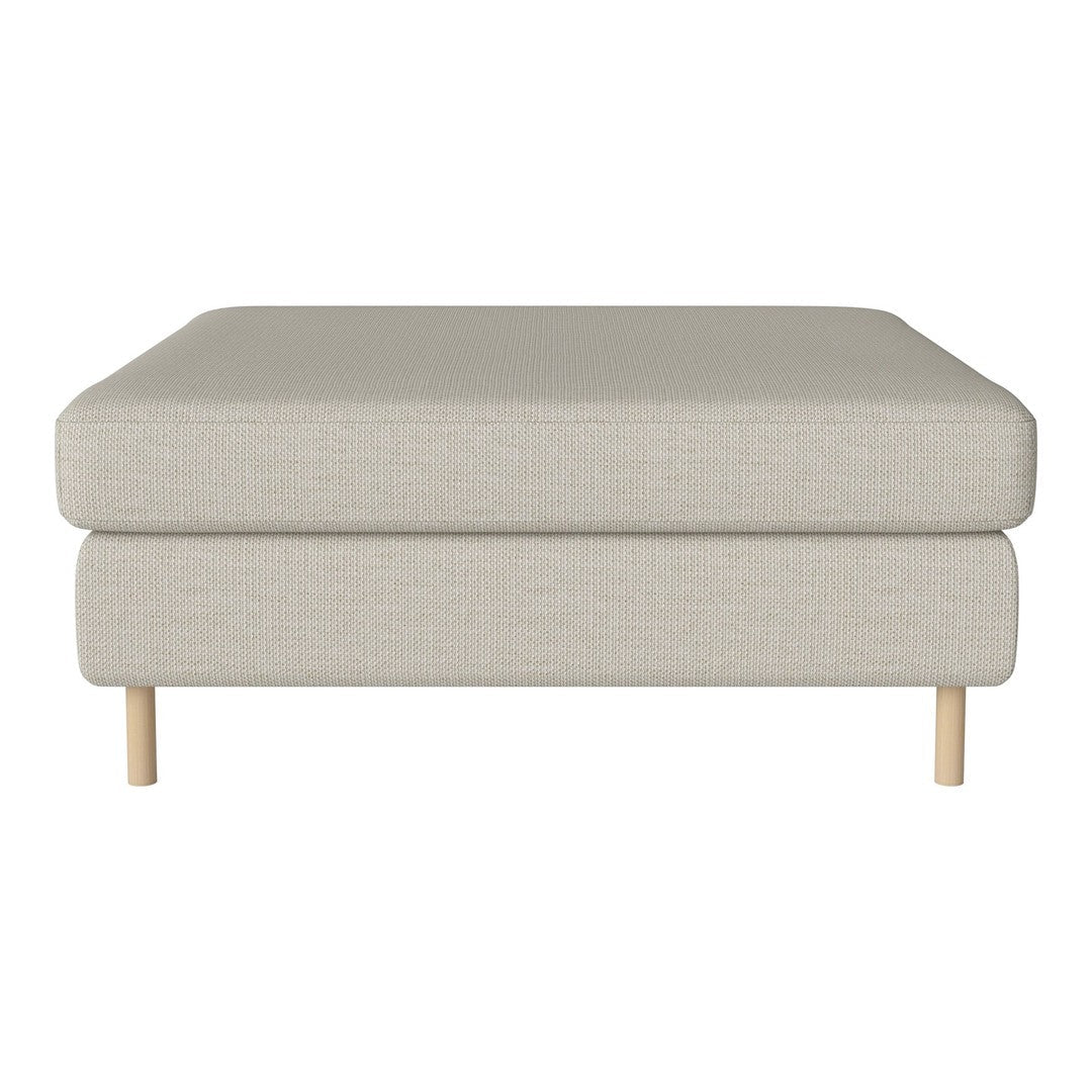Light beige upholstered ottoman with clean lines and natural wood legs. Perfect for modern decor.