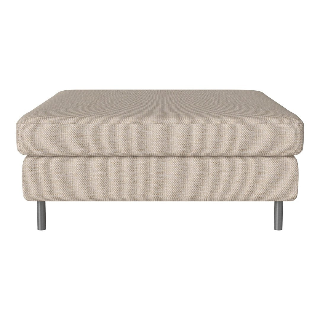 Beige upholstered ottoman with a smooth texture and sleek silver legs, perfect for modern decor.