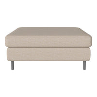 Beige upholstered ottoman with a smooth texture and sleek silver legs, perfect for modern decor.