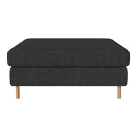 Dark gray upholstered ottoman with a simple, modern design and light wooden legs. Ideal for any contemporary decor.