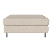 Beige upholstered ottoman with a smooth texture and minimalistic design, featuring silver legs for a modern touch.
