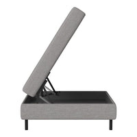 Gray upholstered storage bed base with a sleek pattern and black metal legs, showcasing a modern design.