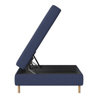 Navy blue upholstered storage bed with textured pattern and wooden legs, partially opened to reveal storage space.