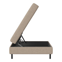 Beige fabric storage bed with a minimalist design and black metal frame. Modern and versatile for any decor.