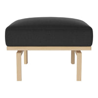 Black upholstered ottoman with a simple, modern wooden base. Minimalist design for contemporary decor.