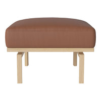 Brown leather cushion on a light wooden frame, featuring a sleek, minimalist design. Perfect for modern interiors.