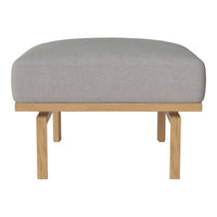 Gray upholstered ottoman with a smooth texture, featuring a light wooden base and minimalist design.
