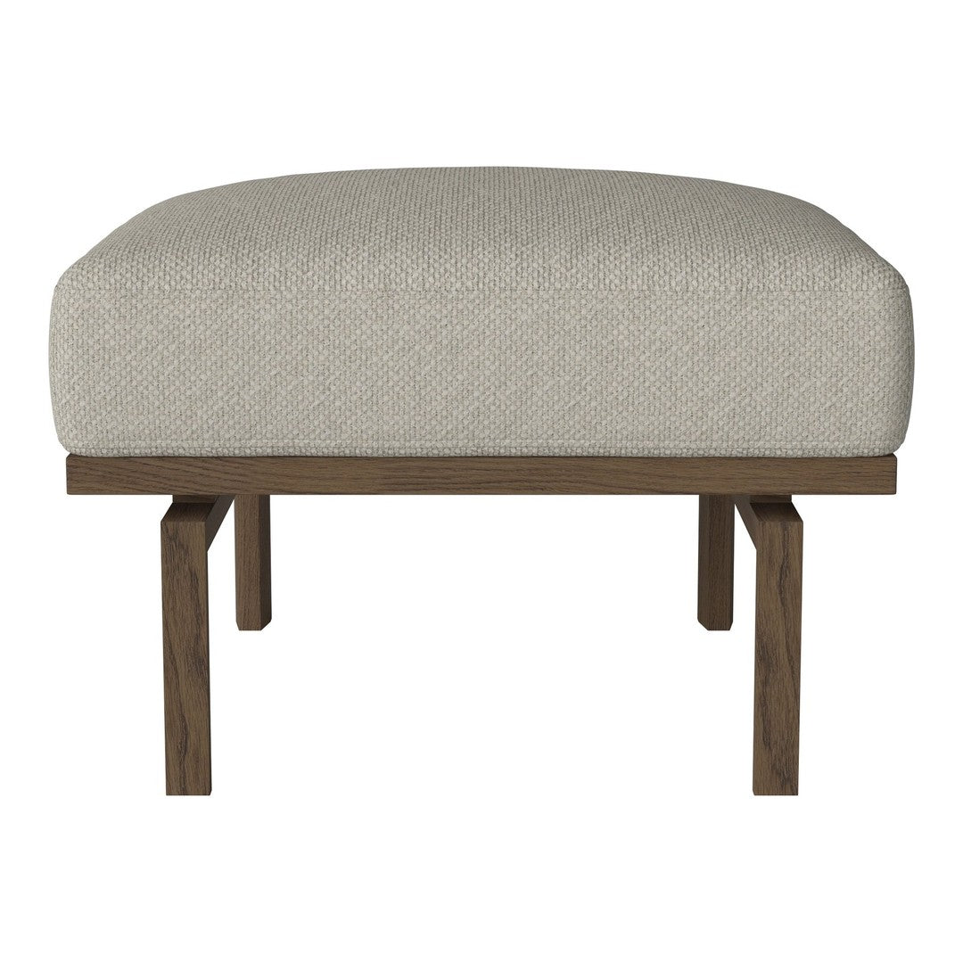 Light beige upholstered ottoman with a smooth texture and dark wooden legs. Clean and modern design.