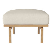 Beige upholstered ottoman with oak legs, featuring a smooth, neutral fabric texture. Ideal for modern decor.