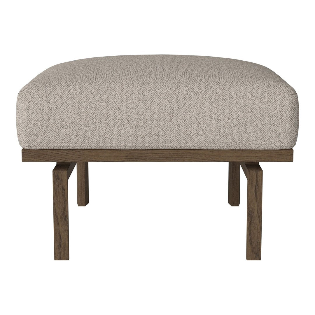 Cream textured upholstery with a smooth, rounded shape, supported by a dark wood frame.
