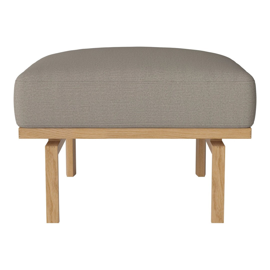Light gray upholstered ottoman with a textured pattern and natural wood legs. Ideal for stylish living spaces.