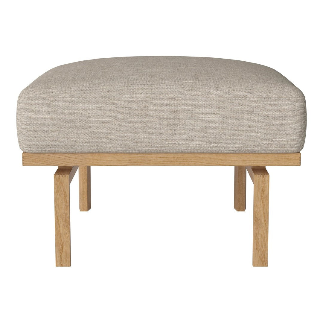Neutral beige upholstered ottoman with a minimalist wooden frame. Soft texture and simple design for versatile decor.