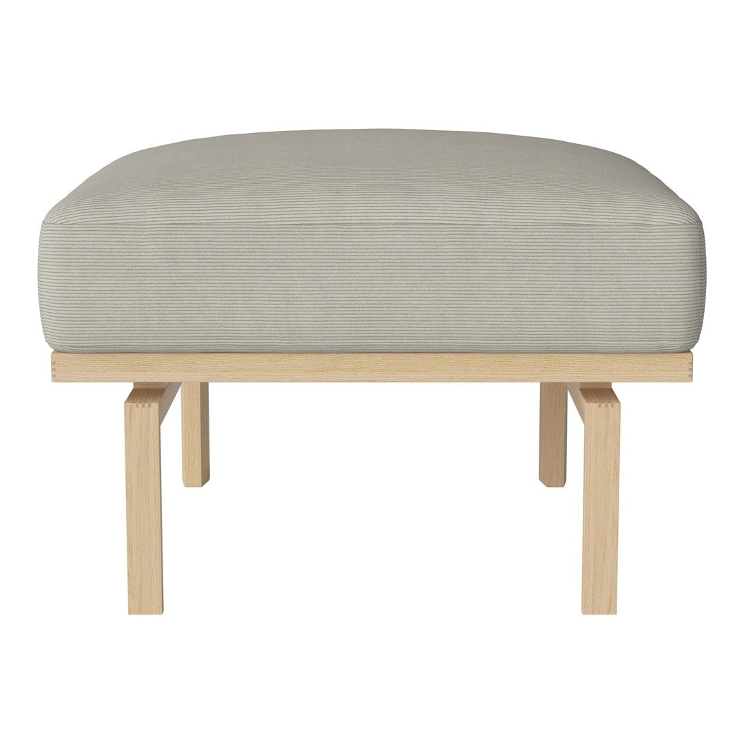 Light gray upholstered ottoman with a smooth texture and natural wood legs, featuring minimalist design and subtle pattern.