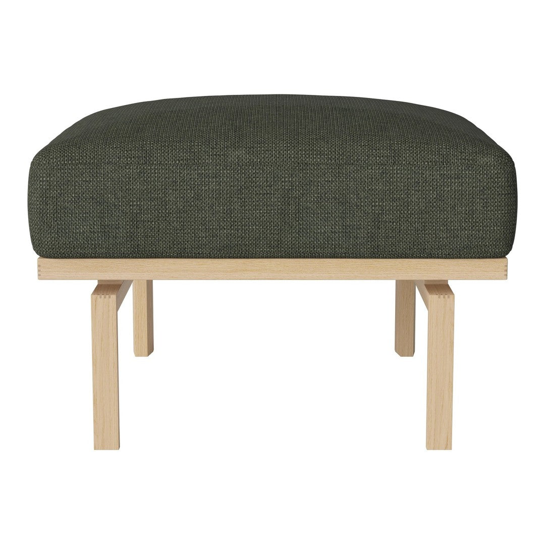 Olive green upholstered ottoman with textured fabric and light wood legs. Modern design for versatile decor.