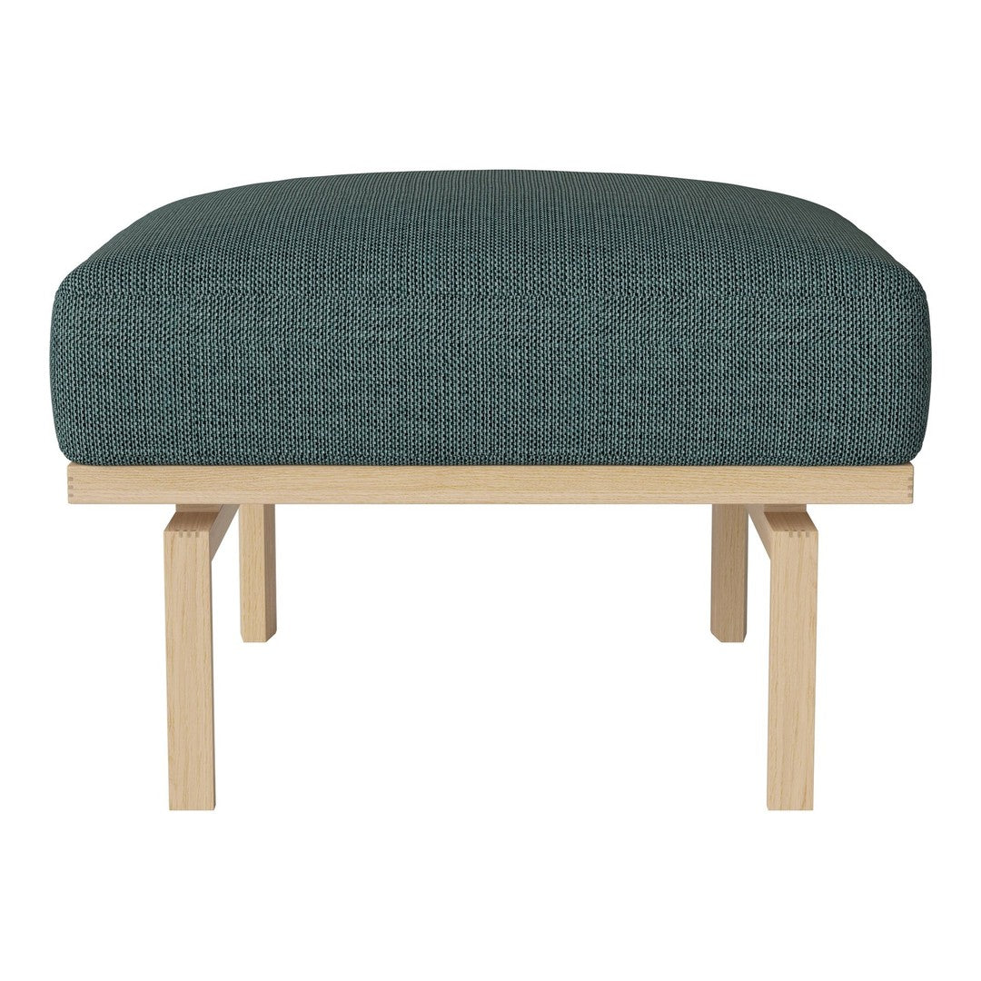 Teal upholstered ottoman with textured fabric and light wood frame. Modern design for versatile decor.