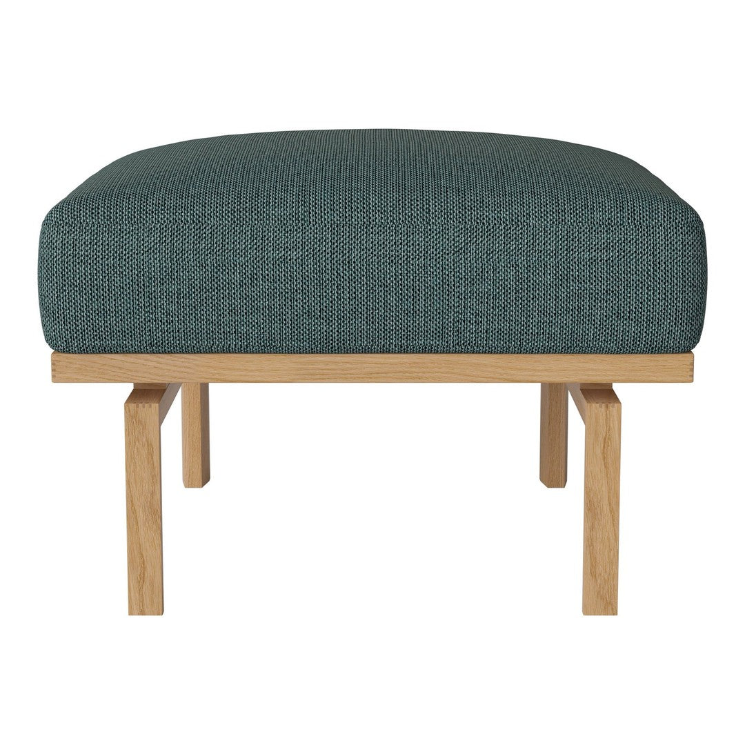 Teal upholstered ottoman with a textured pattern and natural wood legs. Ideal for modern living spaces.
