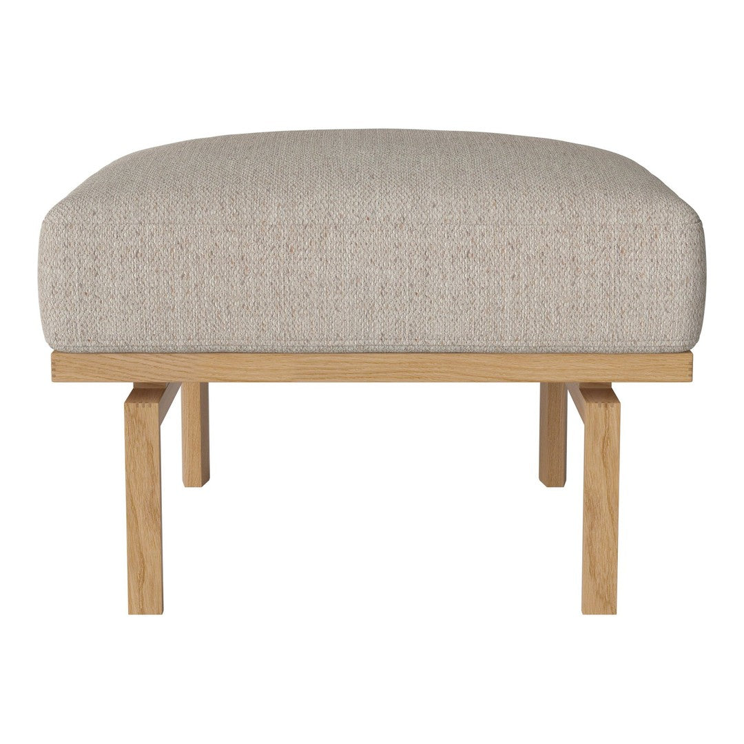 Beige upholstered ottoman with a textured fabric over a natural wood frame. Minimalist design for modern decor.