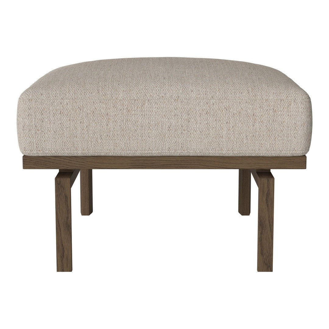 Light beige upholstered ottoman with a textured fabric, supported by dark wooden legs.