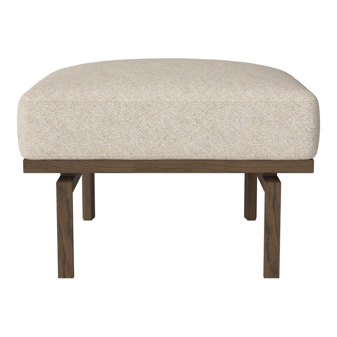 Cream upholstered ottoman with a smooth texture and dark wooden legs, featuring a minimalist design.