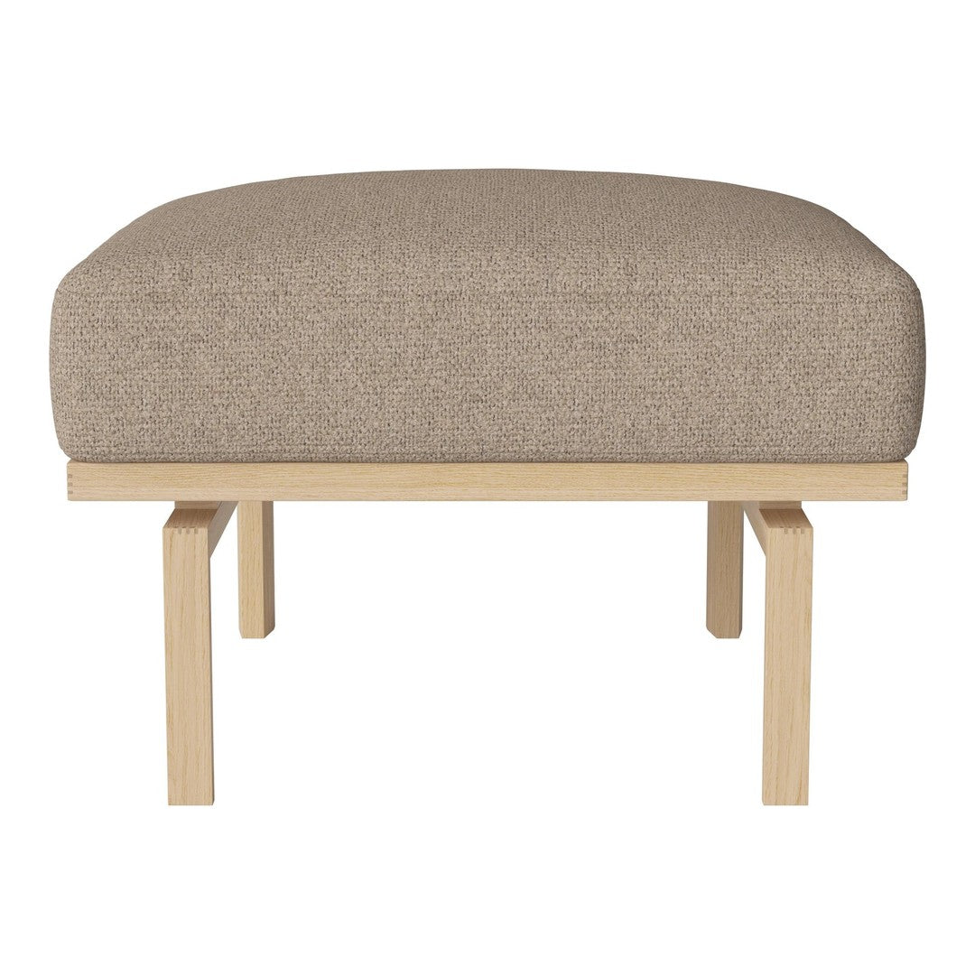 Light beige upholstered ottoman with a smooth texture and natural wooden legs.