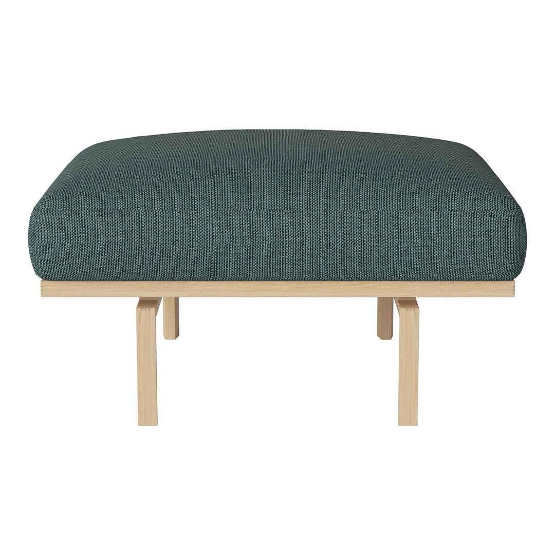 Teal upholstered ottoman with a smooth texture and wooden legs, offering a modern and minimalist design.