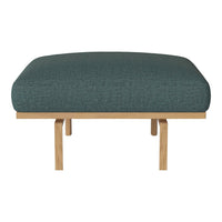 Teal upholstered ottoman with a textured pattern and natural wooden legs. Modern and stylish home decor accent.