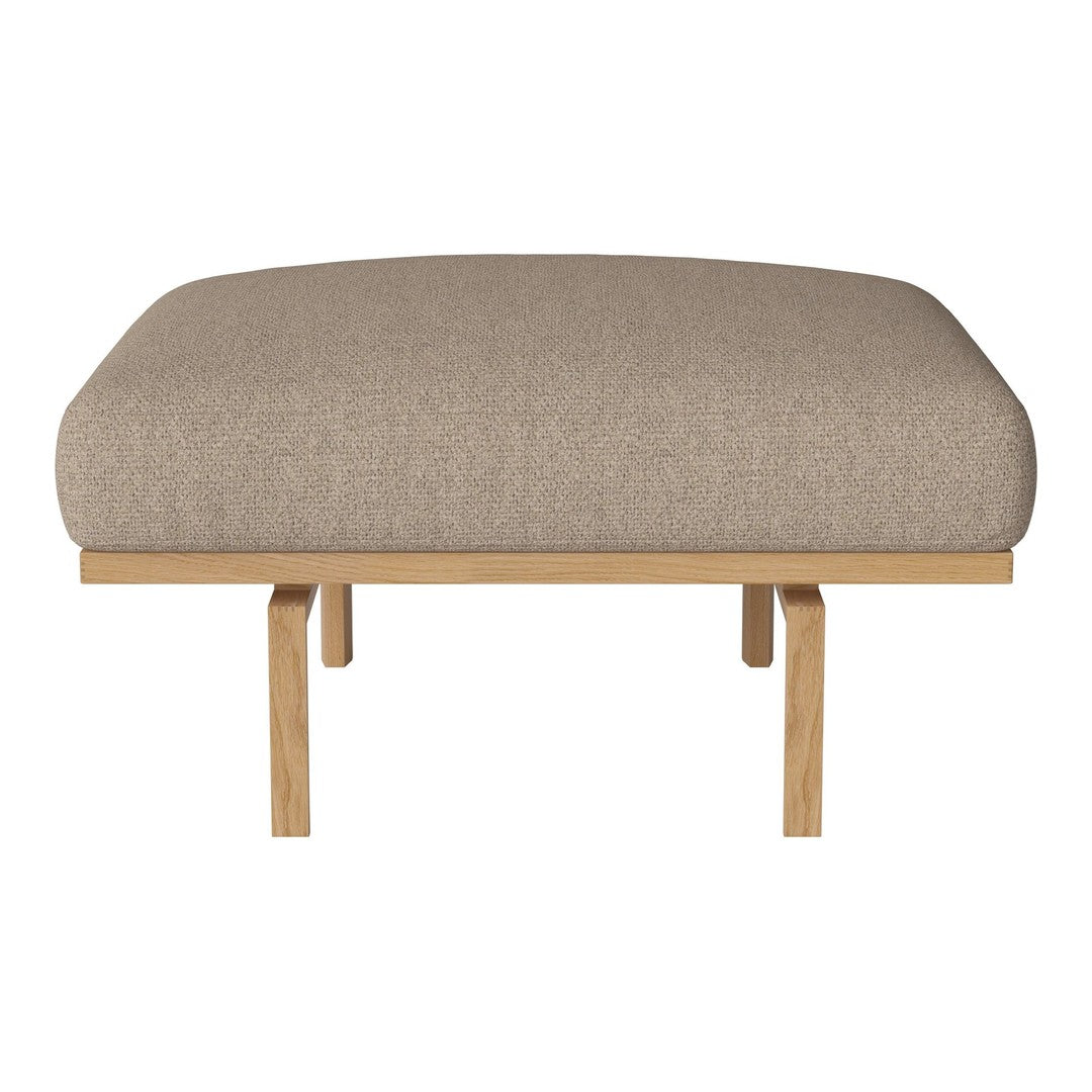 Beige upholstered ottoman with a smooth, textured surface and natural wood legs. Perfect for modern decor.