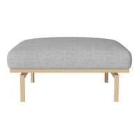 Gray upholstered ottoman with a smooth texture and light wood legs, perfect for modern decor.