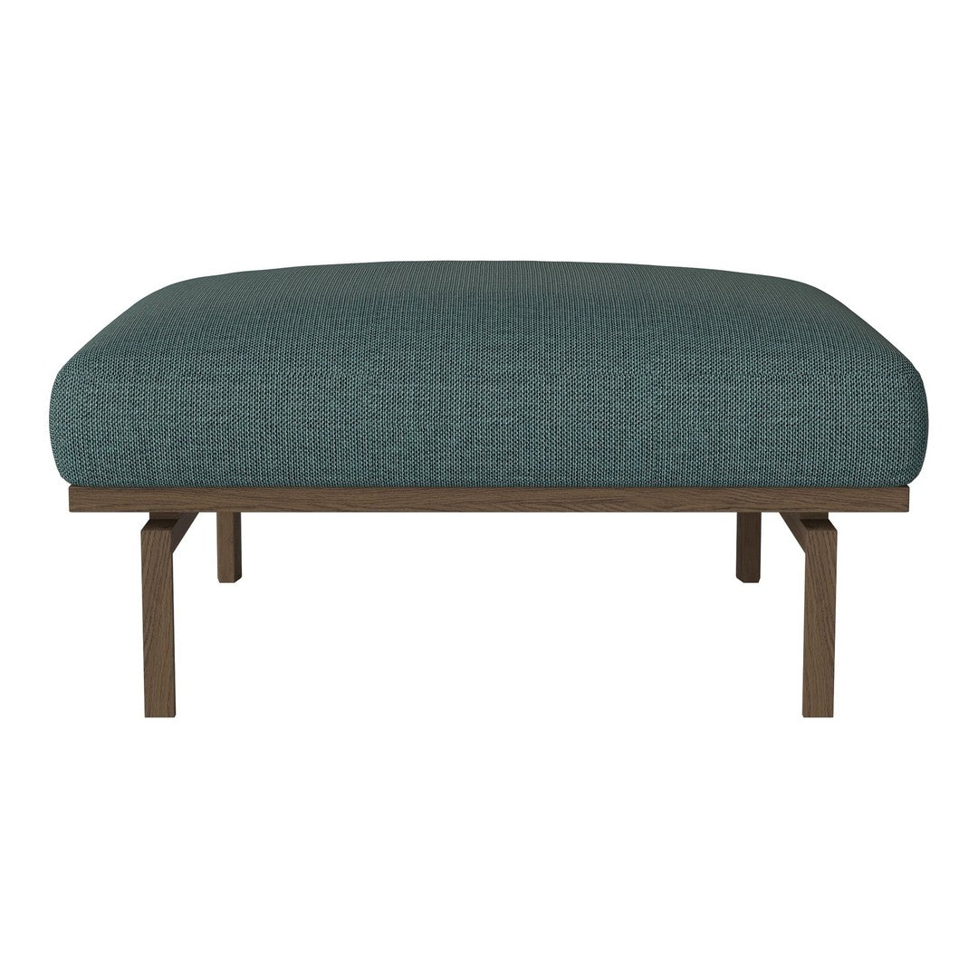 Teal upholstered ottoman with a textured fabric and a sleek, brown metal frame.