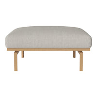 Light gray upholstered ottoman with a smooth texture, set on natural wood legs for a modern, minimalist look.
