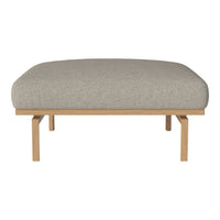 Gray upholstered bench seat with a smooth fabric finish and natural wood legs, offering a minimalist design.